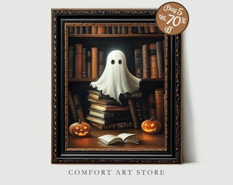 May include: A framed Halloween-themed print featuring a friendly ghost in a library setting. The ghost sits atop a stack of books, with two jack-o'-lanterns and an open book on the table. The print is in a dark wooden frame. The text "COMFORT ART STORE" is at the bottom.
