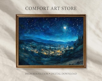 May include: A framed digital download print of a night scene with a starry sky and a bright star. The artwork depicts a city nestled in a valley, illuminated by warm lights. The frame is a dark gold color, and the text "COMFORT ART STORE" is at the top.