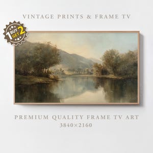 May include: A framed landscape painting depicts a serene river scene with trees and mountains. The artwork features soft colors and a vintage aesthetic. The text "VINTAGE PRINTS & FRAME TV" is at the top.