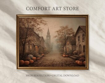 May include: A framed digital print of a village street scene in autumn. The artwork features a cobblestone road lined with houses, trees with orange leaves, and pumpkins. The text "COMFORT ART STORE" and "HIGH RESOLUTION • DIGITAL DOWNLOAD" are visible.