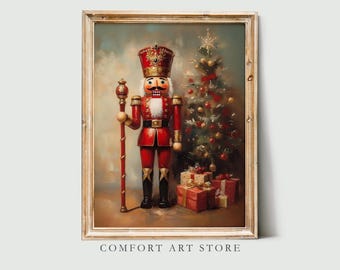 May include: A framed print featuring a vintage-style Christmas scene. A red and gold nutcracker stands beside a decorated Christmas tree and wrapped gifts. The print has a gold frame and the text "COMFORT ART STORE" at the bottom.