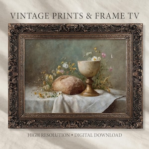 Op de afbeelding: Een ingelijst vintage stilleven schilderij met een brood, een kelk en wilde bloemen op een witte doek. De lijst is donkerbruin met sierlijke details. Tekst bovenaan luidt "VINTAGE PRINTS & FRAME TV" en onderaan "HIGH RESOLUTION • DIGITAL DOWNLOAD".