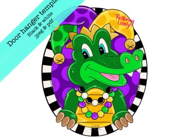 May include: A green alligator wearing a jester hat with yellow and purple polka dots, a purple and gold beaded necklace, and a purple and gold Mardi Gras mask. The background is a black and white striped circle with a purple and white polka dot circle.
