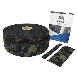 May include: A roll of black and green camouflage hook and loop tape. The tape is rolled up and there are two smaller pieces of tape next to it. The packaging for the tape is in the background. The packaging is blue and white and has the text "MMI Textiles" and "Your Total Textile Resource" on it.