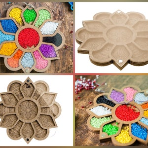 May include: A wooden flower-shaped tray with 10 compartments for organizing small items, such as beads or jewelry. The tray has a clear lid and is decorated with a floral design.