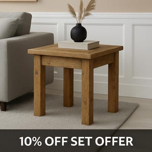 May include: A square, light brown wooden side table with four sturdy legs. A black vase with dried plants and a book rest on the tabletop. The table is on a neutral-colored rug. The image includes the text "10% OFF SET OFFER".