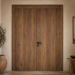 May include: A set of double doors made of brown wood with a visible grain pattern and vertical planks. The doors feature a rectangular frame and a matte black horizontal lever handle with a matching square keyhole plate centered on the right door.