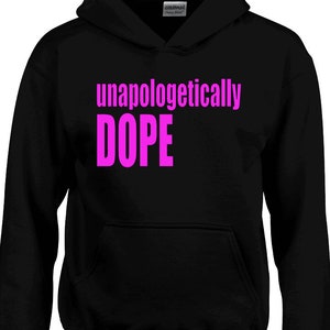 May include: Black hooded sweatshirt with the text "unapologetically DOPE" in pink.