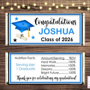 May include: Two candy bar wrappers with a graduation theme. The top wrapper says "Congratulations JOSHUA Class of 2026" with a blue mortarboard and scroll. The bottom wrapper lists "Nutrition Facts" and "Thank you for celebrating my graduation!"