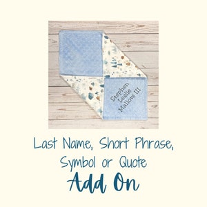 May include: A square baby security blanket featuring a light blue dimpled minky fabric on one side and a white fabric with a forest-themed pattern on the other. The blue side is embroidered with the name Stephen Leslie Mallow, III in dark thread.