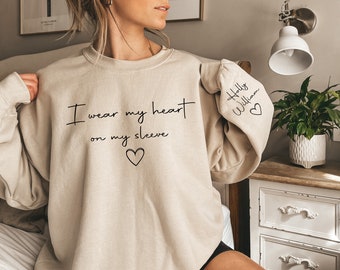 I Wear My Heart On My Sleeve Sweatshirt,Custom Mama Sweatshirt With Kid Name On Sleeve,Personalized Mum Sweatshirt,Mother's Day Gift