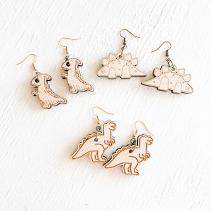 Arquivos SVG para Glowforge para brincos de dinossauro, arquivos para corte a laser de brincos de dinossauro inovadores.