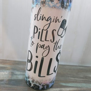 Slinging pills to pay the bills Nurse life 20 oz skinny tumbler, gift, scrubs, pharmacist colorful