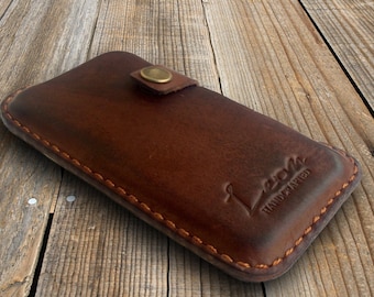 Heavy duty leather Smartphone case, made of Full grain bull leather with a belt clip. + Personalization & Lifetime Warranty