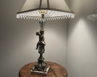 Antique bronze cherub table lamp with a beautiful fabric lampshade on Marble Base. Gorgeous Solid Brass Patina