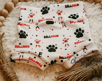 Georgia Bulldog mascot with paws on white bummies, shorties, diaper covers