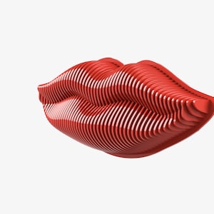 Puede incluir: Una representación 3D de un par de labios rojos, creada con un diseño geométrico en capas.