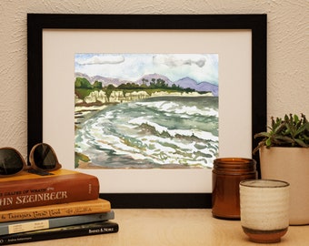 May include: Watercolor painting of a seascape with a rocky shoreline, green hills, and a cloudy sky. The water is a light blue-green color and the waves are white.