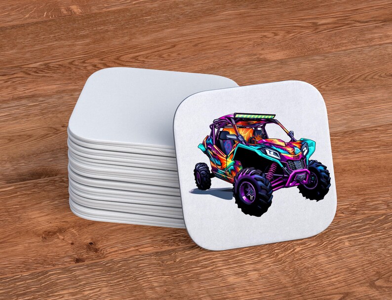 May include: A stack of white coasters with a colorful graphic of an off-road vehicle on the top coaster. The vehicle is painted in shades of orange, purple, blue, and green.