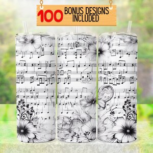 May include: Three stainless steel tumblers with a black and white design featuring musical notes and floral accents. The tumblers have lids and straws.