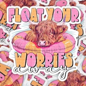 May include: A sticker featuring a Highland cow relaxing in a pink and orange inflatable ring. The text "FLOAT YOUR WORRIES AWAY" is displayed in a playful font, with the word "FLOAT" in pink and orange, and "WORRIES AWAY" in orange and white.