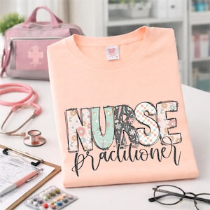 May include: Peach-colored t-shirt with the words "NURSE Practitioner" in a colorful, patterned design. A pink medical bag, stethoscope, and other medical supplies are in the background.