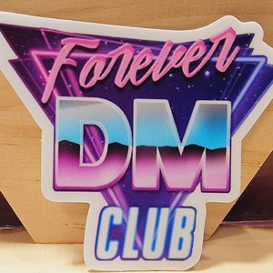 May include: A sticker with a retro 80s design featuring a purple, pink, and blue gradient "DM" logo with the text "Forever DM Club" in pink cursive.