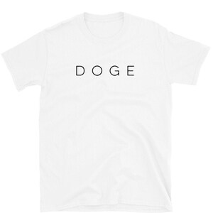 May include: White short-sleeved t-shirt with the word "DOGE" printed in black on the front.