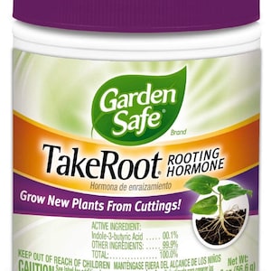 May include: A white plastic jar with a purple lid labelled "Garden Safe TakeRoot Rooting Hormone". The label also says "Grow New Plants From Cuttings!" and "Hormona de enraizamiento". The jar contains a rooting hormone for plants. The jar is 2 ounces (56.6 grams).