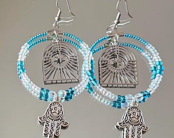 large drop hoop earrings with celestial filigree and blue accent beads with hamsa charms