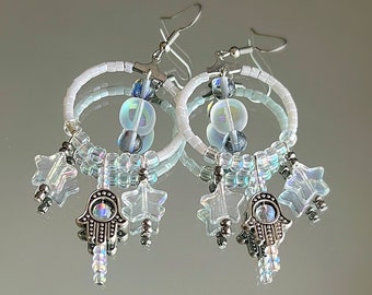 chandelier hoop earrings with faceted iridescent glass beads and a hamsa charm with stars