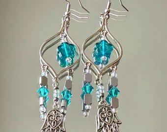 chandelier earrings with teal flowers and three tiers with iridescent & hamsa beads