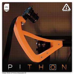 May include: An orange 3D printed camera mount with a black camera attached. The mount is designed to be used with a 3D printer. The text "PiTHON" is visible in the lower part of the image. The text "Design, Model, & Print by Indisposable 3D" is also visible.