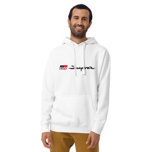 May include: White hooded sweatshirt with a black and red "GR Supra" logo printed on the front.