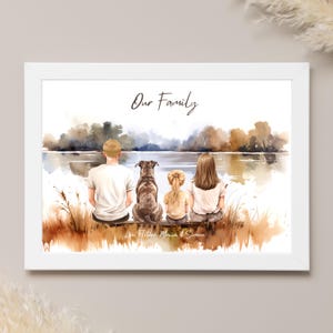 May include: A framed watercolor print depicts a family and their dog sitting by a lake. The words "Our Family" are written above the image. The family members are facing away from the viewer. The names "Ace, Fletcher, Monica & Simone" are written below the image.