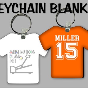 Puede incluir: Llaveros en blanco con forma de camisetas. Uno es blanco con el texto "Sublimation Blanks .net" y un gr&aacute;fico. El otro es naranja con el nombre "MILLER" y el n&uacute;mero "15". Ambos tienen llaveros plateados y el texto "KEYCHAIN BLANKS" arriba.
