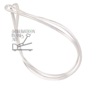 May include: Clear, flexible tubing looped into a figure-eight shape. The tubing appears transparent and is likely made of plastic or a similar material. The text "SUBLIMATION BLANKS .NET" is visible in the lower left corner, along with a graphic of a foot pedal.