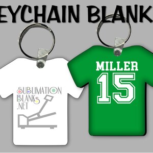 Puede incluir: Dos llaveros en blanco con forma de camiseta. Uno es blanco con el texto "SUBMLIMATION BLANKS .NET" y un gr&aacute;fico de una prensa t&eacute;rmica. El otro es verde con el nombre "MILLER" y el n&uacute;mero "15" en blanco.