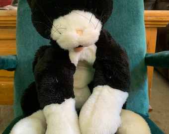 Folkmanis black and white tuxedo cat puppet.