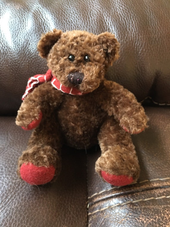 teddy bear with red scarf