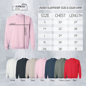 May include: Unisex sweatshirt size and color chart with measurements in inches. The chart shows sizes S, M, L, XL, and 2XL with corresponding chest and length measurements. The chart is accompanied by images of sweatshirts in white, black, sand, pink, navy, military green, and red.