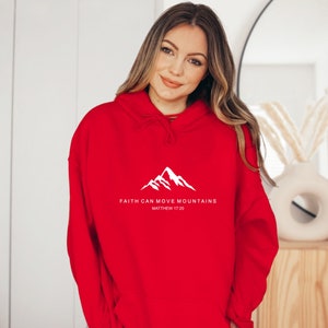May include: Red hooded sweatshirt with a white mountain graphic and the text "FAITH CAN MOVE MOUNTAINS MATTHEW 17:20"