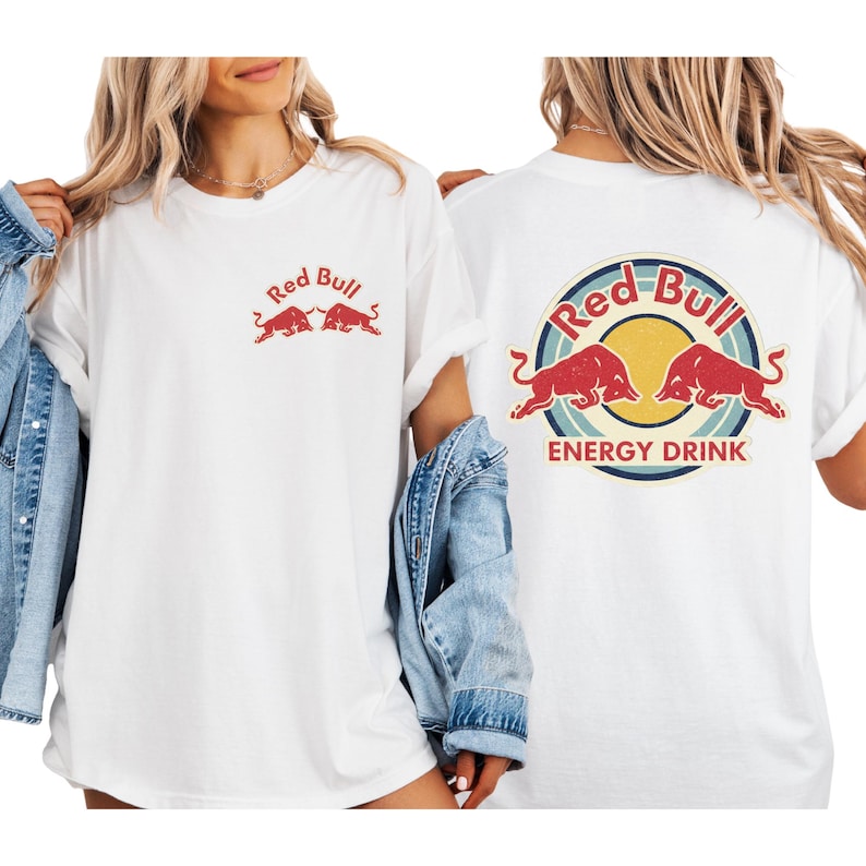 two women wearing white t-shirts with the Red Bull logo and the text "Red Bull Energy Drink" printed on them.