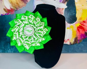 LINKS White Print Fabric and Green Flower Brooch with Branded Pearl Center - The Links, Incorporated
