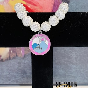 JJOA White Sparkle Bead Bracelet with Color Seal JJ Logo Charm - Jack and Jill of America