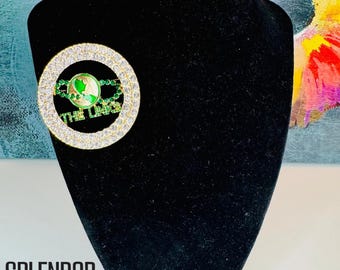The LINKS Oversized Globe Brooch with Rhinestone Trim