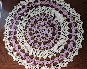 Lacy white and lavender doily