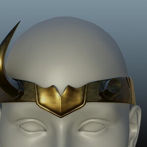 May include: A gold headband with a single horn on the left side. The headband has a decorative, pointed, V-shaped design in the center.