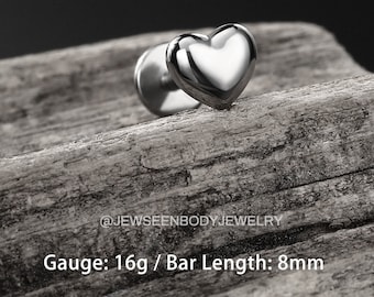 May include: Silver heart shaped barbell piercing with a 16 gauge and 8mm bar length.  @Jewseenbodyjewelry