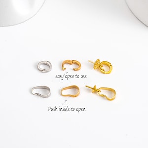 May include: An assortment of jewelry clasps in gold and silver tones. The clasps are in various shapes, including oval and circular designs. Text on the image reads "easy open to use" and "Push inside to open".